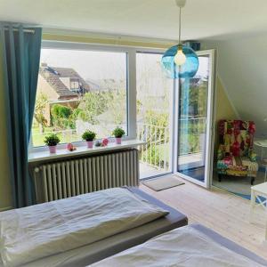Postel nebo postele na pokoji v ubytování Dein Ferienhaus Strandstrasse