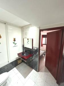 a bathroom with a sink and a toilet at Hyatt Residence Casa Voyageur in Casablanca