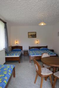 Posteľ alebo postele v izbe v ubytovaní 4 fös apartman