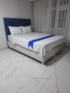 Ένα ή περισσότερα κρεβάτια σε δωμάτιο στο sanita otel