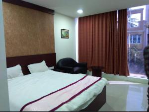 Krevet ili kreveti u jedinici u okviru objekta Hotel Shiv shakti residency