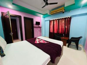 Krevet ili kreveti u jedinici u okviru objekta Hotel Shiv shakti residency