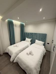 Ένα ή περισσότερα κρεβάτια σε δωμάτιο στο Greis Apartments 3