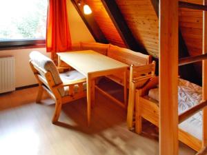 a dining room with a table and a bunk bed at Ferienhaus, Burhave in Burhave