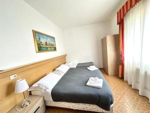 Postel nebo postele na pokoji v ubytování Hotel Tito