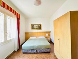 Postel nebo postele na pokoji v ubytování Hotel Tito