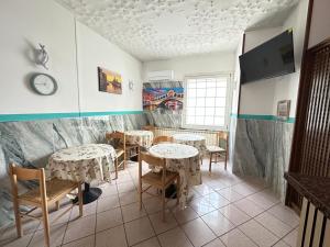 TV a/nebo společenská místnost v ubytování Hotel Tito