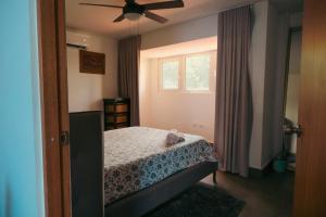 Ένα ή περισσότερα κρεβάτια σε δωμάτιο στο Caribe Rentals - Miramar