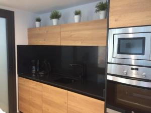 Kuchyňa alebo kuchynka v ubytovaní Residence Muna 3055