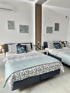 Posteľ alebo postele v izbe v ubytovaní Exclusive Apartments Smolna + 37 fotografií
