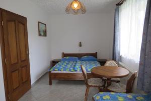 Posteľ alebo postele v izbe v ubytovaní 3 fös apartman
