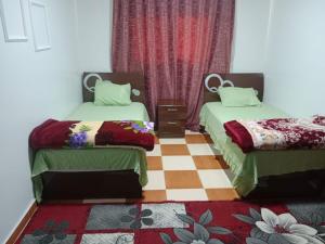 Postel nebo postele na pokoji v ubytování Al Sharif Hotel Apartments + 21 fotografií