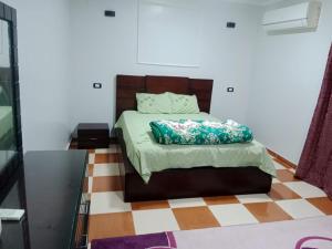 Postel nebo postele na pokoji v ubytování Al Sharif Hotel Apartments