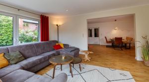 a living room with a couch and a table at Villa Agni in Dänschendorf
