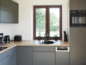 a kitchen with a sink and a window at holiday home in Stepnica for 6 persons in Stepnica +17 photos