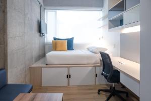 Spotty Bogotá Centro客房内的一张或多张床位