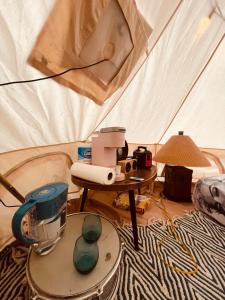 a tent with a blender and a table in it at Casa de Campaña en la Pequeña Selva by Legnalife in Homestead +31 photos