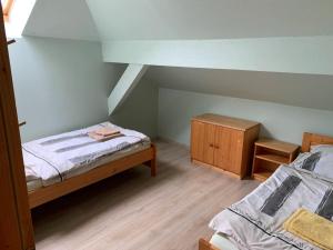 Postel nebo postele na pokoji v ubytování Apartmány Šumava Boubín