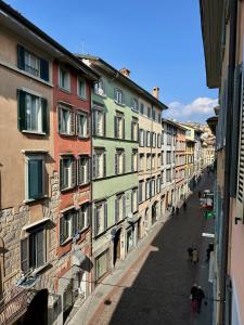a view of a city street with buildings at Magic Place Bergamo! Beauty Nest Apartment in the heart of the city in Bergamo +64 photos