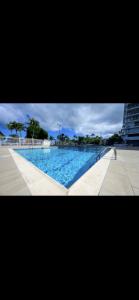 a picture of a swimming pool with blue water at Oceanfront Isla Verde 2B 2B Apartment Paradise Getaway in San Juan