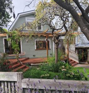 a house with a fence in front of it at Aquavilla Studio in Plimmerton