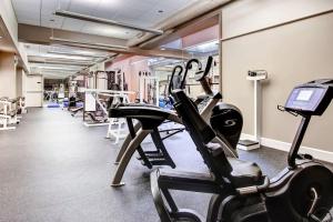 a gym with two treadmills and cardio machines at Woods Village 43 in Killington