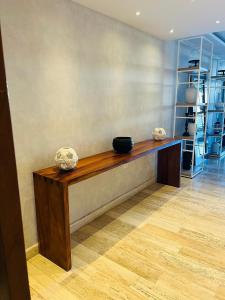 a counter in a room with two bowls on it at Marina Condos Corazón 201 in Cancún +153 photos