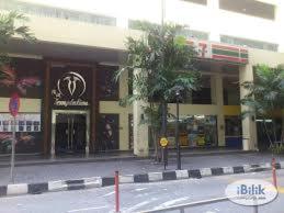 a building on a street in front of a street at Richone Maluri Private Hotel in Kuala Lumpur