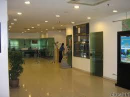 a woman is standing in an office lobby at Richone Maluri Private Hotel in Kuala Lumpur +34 photos