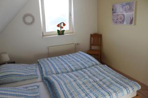Ένα ή περισσότερα κρεβάτια σε δωμάτιο στο Ferienhaus Steen +9 φωτογραφίες