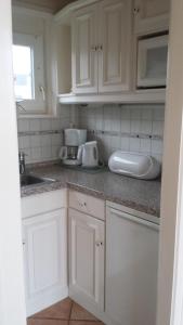 Køkken eller tekøkken på Strandgut - Bungalow am Meer