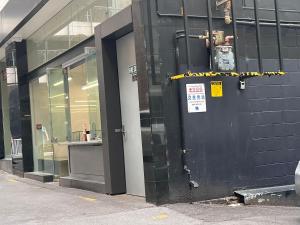 a building with a black door on the side of it at Auckland City Central 2bedroom big living room wifi public parking nearby in Auckland