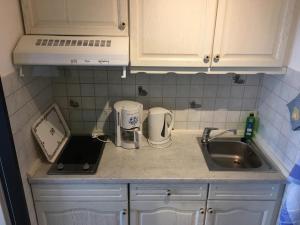 Kuchyň nebo kuchyňský kout v ubytování Ferienwohnung Thordsen 5