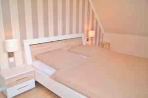 Postel nebo postele na pokoji v ubytování Haus Swantje - Fewo 2