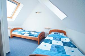 Postel nebo postele na pokoji v ubytování Haus Swantje - Fewo 2 + 8 fotografií