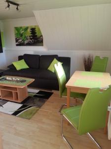 a living room with a couch and a table at Ferienwohnung "Bittner" in Altratjensdorf