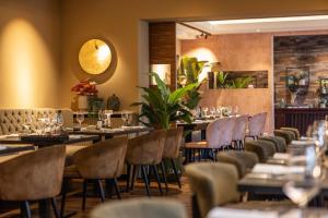 a row of tables and chairs in a restaurant at Gasthaus Stappen in Korschenbroich