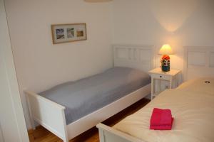 Ein Bett oder Betten in einem Zimmer der Unterkunft "Ferienhaus Strandläufer"