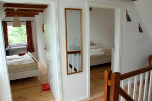 Ein Bett oder Betten in einem Zimmer der Unterkunft "Ferienhaus Strandläufer"