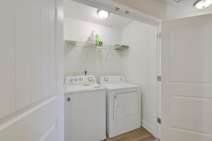 a white kitchen with a stove and a dishwasher at 5 Mi to Charlotte Motor Speedway Cozy Townhome in Concord +20 photos
