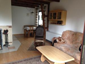 a living room with a couch and a table at Ferienhaus Gappa in Bad Wilsnack