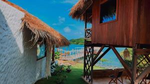 a building with a view of a body of water at Cocal Exclusive in Salinópolis