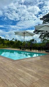 Πισίνα στο ή κοντά στο Chalés Pura Vida