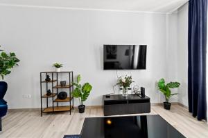 TV a/nebo společenská místnost v ubytování Fast Wifi I 4 min to U3 Zipperer Straße
