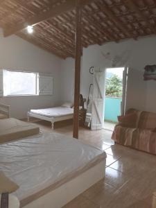 Katil atau katil-katil dalam bilik di Ubatuba SP Sertão Ubatumirim Casa para até 10 pessoas