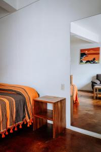 Ένα ή περισσότερα κρεβάτια σε δωμάτιο στο Terraza Puerto Hostel