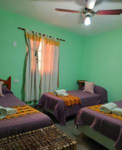 Postel nebo postele na pokoji v ubytování Mai Jaii