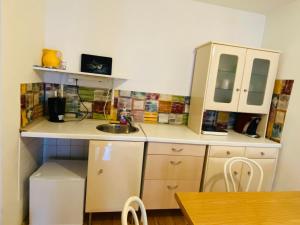 a small kitchen with a sink and a counter at Wohnung mit Balkon, Graz Zentrum in Graz