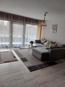 a living room with a couch and a table at Appartment 025 in Tossens in Tossenserdeich