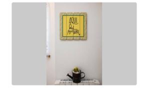 a picture hanging on a wall above a stove at BeGuest Casetta Cleo in Páteo +2 photos